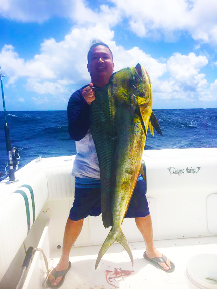 Guy reeling in a monster USVI Sport Fishing from the Mixed Bag with Captain Rob